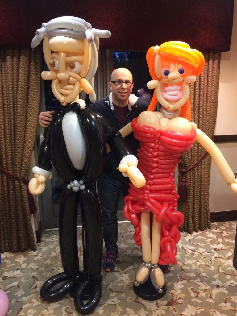 Benny with a life-size balloon couple