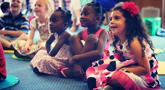 Children smiling and laughing during Benny’s comedy magic show
