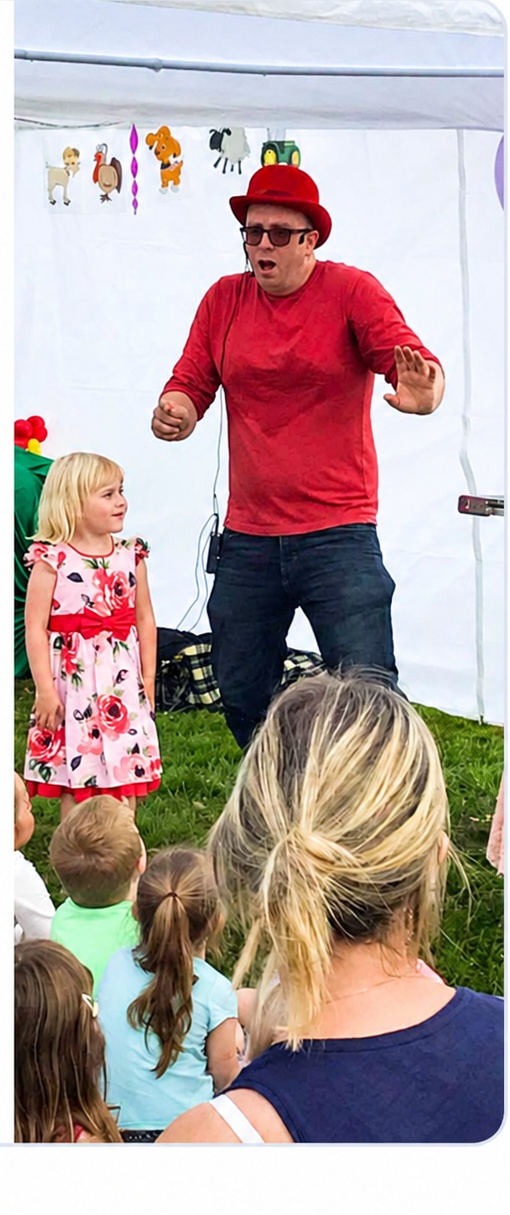 Benny entertaining children at a party