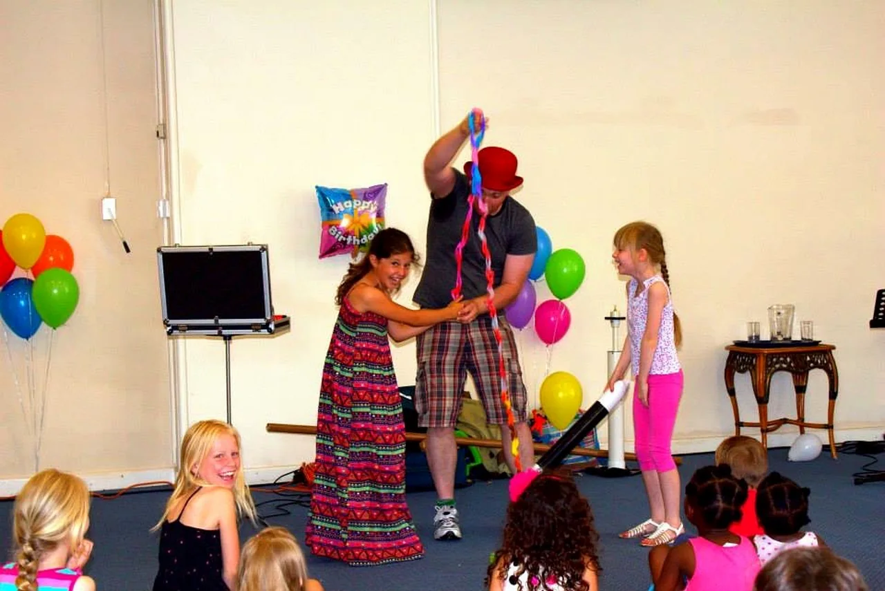 Children joining Benny during a real comedy magic show