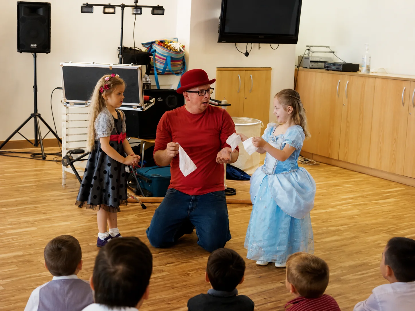 A birthday child joining Benny in an interactive magic routine